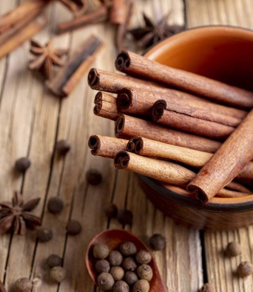 high-angle-bowl-with-cinnamon-sticks-star-anise-pepper